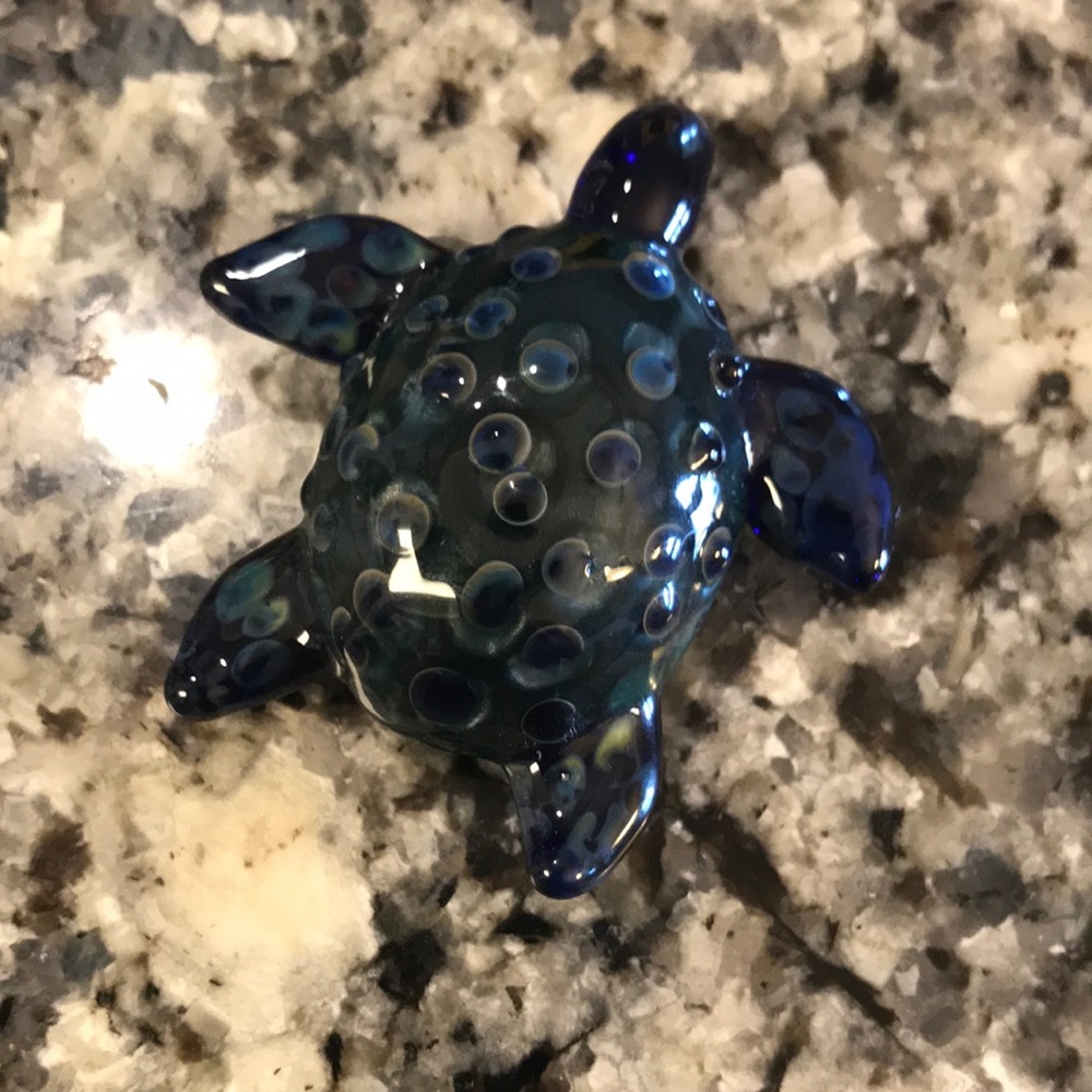 Hand blown glass turtle pendant.